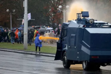 Police use a water cannon truck to disperse demonstrators during a rally to protest against the Belarus presidential election results in Minsk Oct 11 2020 Credit Stringer AFP via Getty Ima