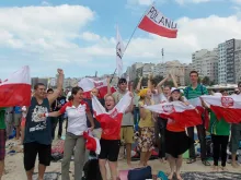 Polish pilgrims celebrate after hearing the news that the next World Youth Day will be hosted by Krakow, Poland in 2016. 