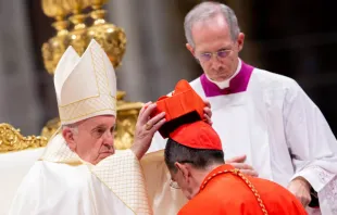 Pope Francis places the red biretta on Cardinal Miguel Ángel Ayuso Guixot Oct. 5, 2019.   Daniel Ibanez/CNA.