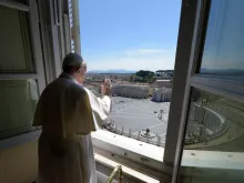 Pope Francis offers a blessing from the window of the Apostolic Palance April 26, 2020. 