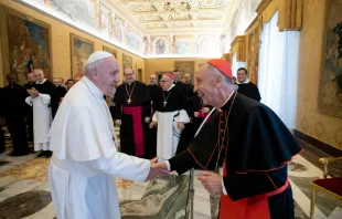 Pope Francis greets Cardinal Luis Francisco Ladaria, who as prefect of the CDF, leads the International Theological Commission.   Vatican Media.