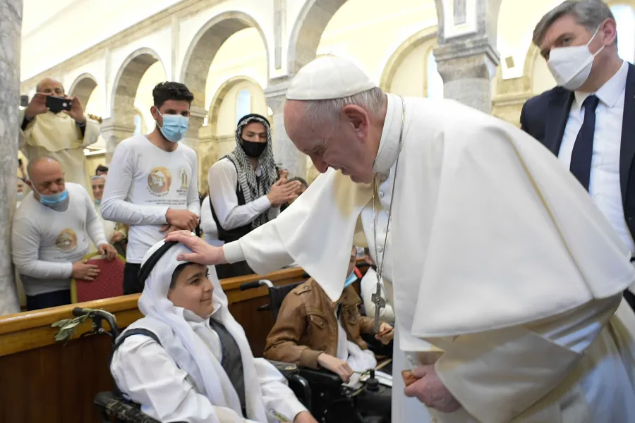 Pope Francis blesses a young boy in the Syriac Catholic Church of the Immaculate Conception in Bakhdida, Iraq, on March 7, 2021. Photo credits: Vatican Media.?w=200&h=150