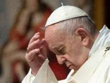 Pope Francis prays in St. Peter's Basilica on June 14, 2020. 