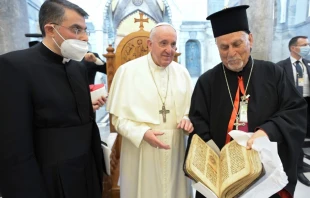 Pope Francis returns a historic prayer manuscript to Immaculate Conception Church in Bakhdida, Iraq, March 7, 2021.  Credit: Vatican Media.