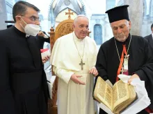 Pope Francis returns a historic prayer manuscript to Immaculate Conception Church in Bakhdida, Iraq, March 7, 2021.  Credit: Vatican Media.