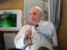 Pope Francis speaks during an in-flight press conference en route from Rome to Iraq March 8, 2021. Caption: Colm Flynn/CNA. 