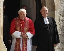 Pope Benedict XVI and Nikolaus Schneider, president of the council of the Evangelical Church in Germany, walk to the ecumenical devotion. ?w=200&h=150