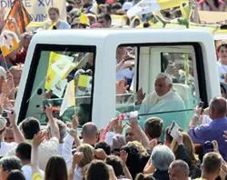 Pope Benedict moves through the crowd in his popemobile at World Youth Day in Madrid. ?w=200&h=150