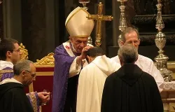 Pope Benedict XVI distributes ashes during Ash Wednesday Mass at St. Peter's Basilica on Feb. 13, 2013. ?w=200&h=150