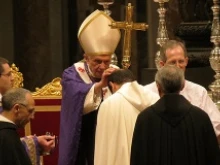 Pope Benedict XVI distributes ashes during Ash Wednesday Mass at St. Peter's Basilica on Feb. 13, 2013. 