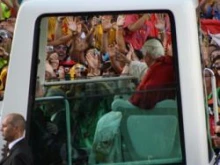 Pope Benedict XVI is greeted by pilgrims. 