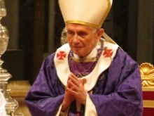 Pope Benedict XVI reacts to applause during Ash Wednesday Mass at St. Peter's Basilica Feb. 13, 2013. 
