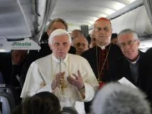 Pope Benedict speaks to reporters aboard the papal plane ahead of his visit to the UK in Sept. 2010