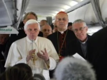 Pope Benedict XVI speaks to journalists aboard the papal plane