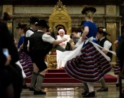 Children dressed in traditional Bavarian costumes dance for the Pope during his 85th birthday celebrations in the Clementine Hall. ?w=200&h=150