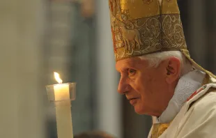 Benedict XVI holding the Pascal Candle on Easter Vigil, Saturday April 7, 2012 in Vatican City.   L'Osservatore Romano.