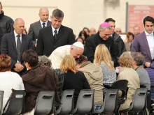 Pope Francis embraces the sick at a General Audience in St. Peter's Square, Nov. 18, 2015. 
