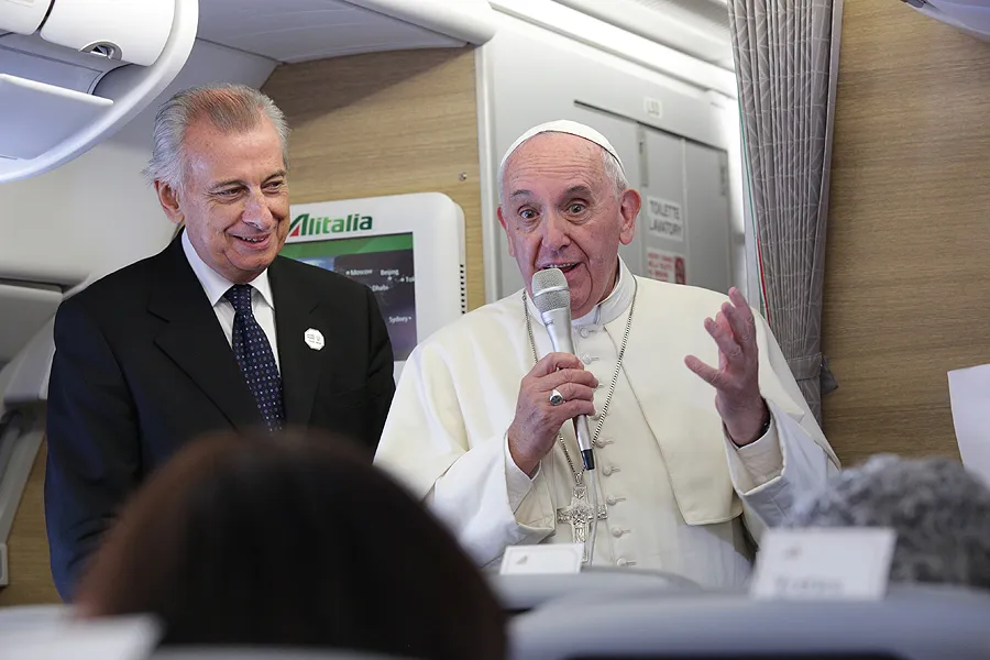 Pope Francis aboard the papal flight from Cuba to Washington, D.C., Sept. 22, 2015. ?w=200&h=150