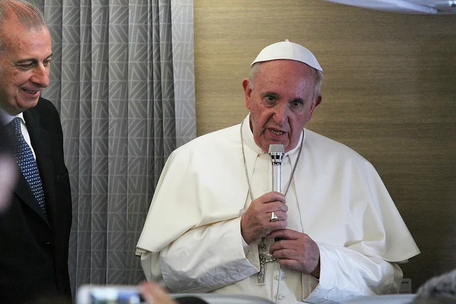 Pope Francis speaks to reporters aboard the papal flight from Africa to Italy, Nov. 30, 2015. ?w=200&h=150