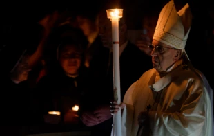 Pope Francis bears the paschal candle during the Easter Vigil Mass at St. Peter's Basilica, March 31, 2018.   Daniel Ibanez/CNA.