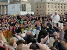 Pope Francis rides through St. Peter's Square at the April 3, 2013 general audience. 