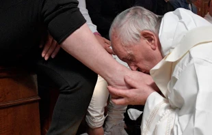 Pope Francis kisses the feet of an inmate at Paliano prison during Holy Thursday Mass April 13.   L'Osservatore Romano.