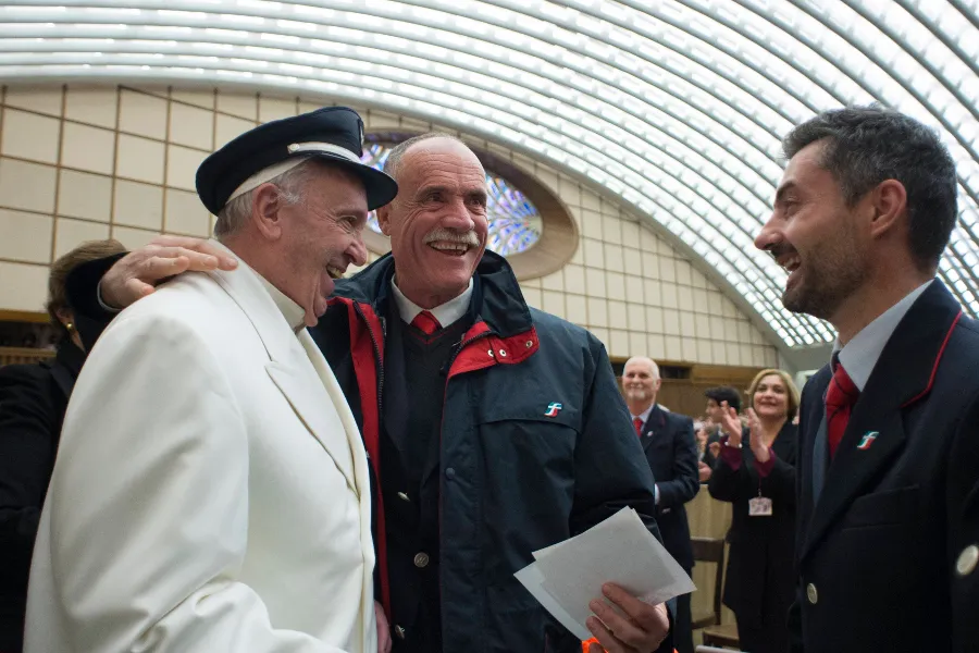 Pope Francis borrows a railroad worker's cap at a Dec. 19 gathering. ?w=200&h=150