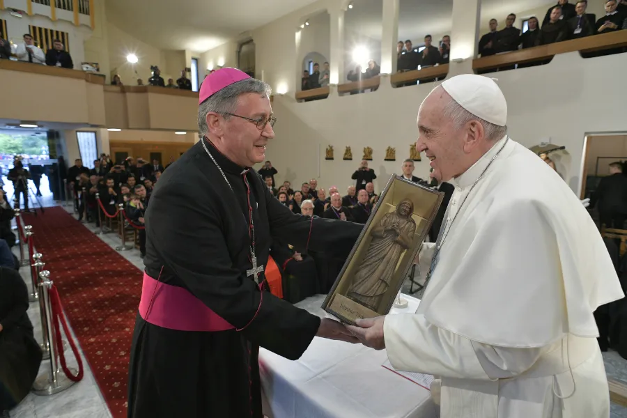 Pope Francis holds a small sculpture of Mother Teresa in Skopje's cathedral May 7, 2019. ?w=200&h=150