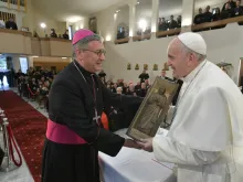 Pope Francis holds a small sculpture of Mother Teresa in Skopje's cathedral May 7, 2019. 