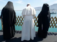 Pope Francis, Patriarch Bartholomew and Archbishop Ieronymos look out at the sea from Lesbos Apri. 16. 