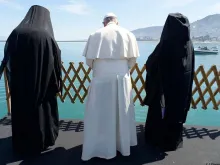 Pope Francis, Patriarch Bartholomew and Archbishop Leronymos look at the sea from Lesbos on April 16, 2016.