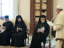Pope Francis addresses delegates of Bartholomew I, Ecumenical Patriarch of Constantinople, at the Private Library of the Apostolic Palace in the Vatican, June 27, 2015. 