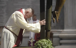 Pope Francis prays by the crucifix in St. Peter's Basilica April 10, 2020.   Vatican Media.