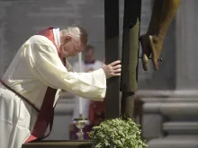 Pope Francis prays by the crucifix in St. Peter's Basilica April 10, 2020. 
