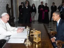 Pope Francis and US President Barack Obama speak during a private audience at athe Vatican, March 27, 2014. 