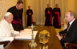 Pope Francis and Vladimir Putin inside the Vatican on November 25, 2013.   ANSA/CLAUDIO PERI/POOL.