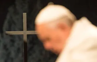 Pope Francis and a cross during the Stations of the Cross at the Coliseum in Rome, Italy on April 3, 2015.   L'Osservatore Romano.