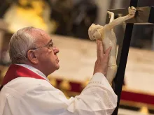 Pope Francis venerates the cross on Good Friday 2015. 