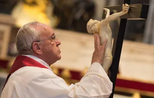 Pope Francis and the cross at the Liturgy of the Lord's Passion at St. Peter's Basilica on April 3, 2015.   L'Osservatore Romano.