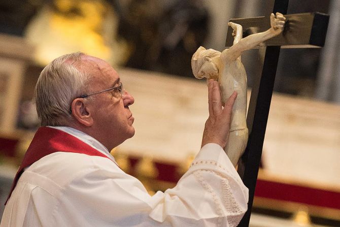 Pope Francis and the cross at the Liturgy of the Lords Passion at St Peters Basilica on April 3 2015 Credit  LOsservatore Romano CNA 4 3 15