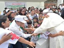 Pope Francis is greeted by a crowd at Padre Aldamiz International Airport in Puerto Maldonado, Peru, Jan. 19, 2018. 