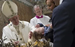 Pope Francis baptizes a baby in the Sistine Chapel Jan. 10, 2016.   L'Osservatore Romano.