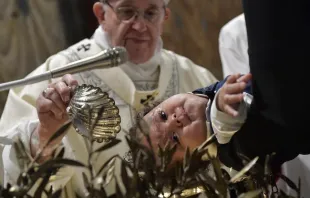 Pope Francis baptizes a baby in the Sistine Chapel Jan. 13, 2019.   Vatican Media.