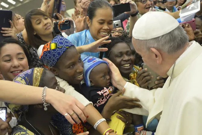 Pope Francis blesses a baby 1 at the general audience in Paul VI Hall on Aug 19 2015 Credit LOsservatore Romano CNA 8 19 15