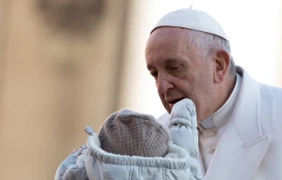 Pope Francis blesses a baby at the General Audience in St. Peter's Square on Nov. 22, 2017.   Daniel Ibanez/CNA.