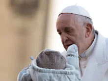 Pope Francis blesses a baby at the General Audience in St. Peter's Square on Nov. 22, 2017.