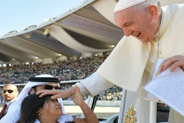 Pope Francis blesses a child at Abu Dhabi Mass Feb52019 Credit Vatican Media CNA Size