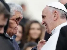 Pope Francis blesses a sick man after his general audience in St. Peter's Square Nov. 20, 2013. 