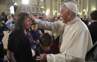 Pope Francis blesses a woman after venerating the relics of Peruvian saints in the Cathedral of Lima, Jan. 21.    Vatican Media/CNA