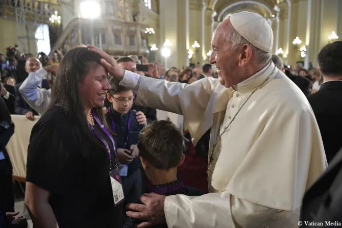 Pope Francis blesses a woman after venerating the relics of Peruvian Saints in the Cathedral of Lima Jan 21 2018 Credit Vatican Media CNA